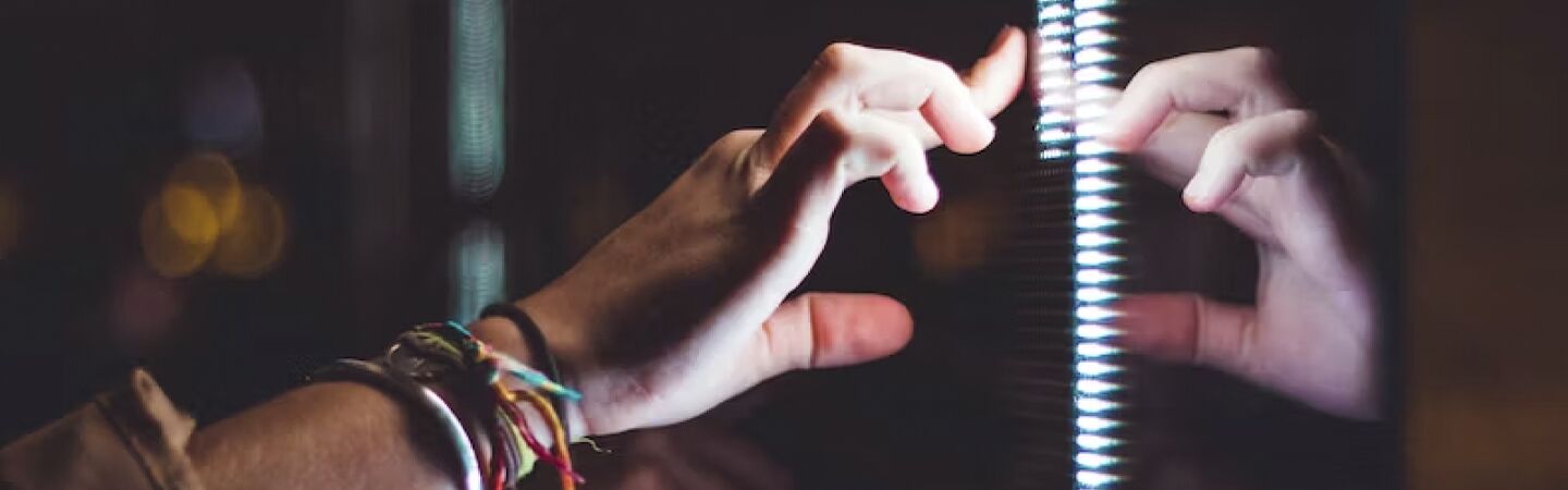 A hand touching a screen