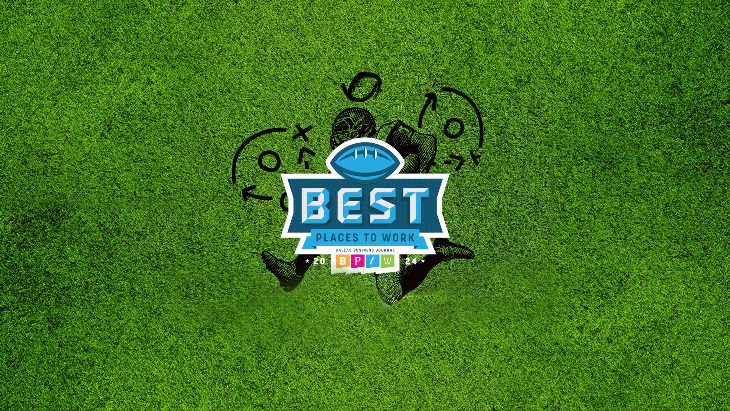 A grassy football field with a logo at the center that reads 'Best Places to Work 2024 - Dallas Business Journal' featuring a blue football icon at the top. Surrounding the logo are chalked football play diagrams and a shadowed silhouette of a football player.